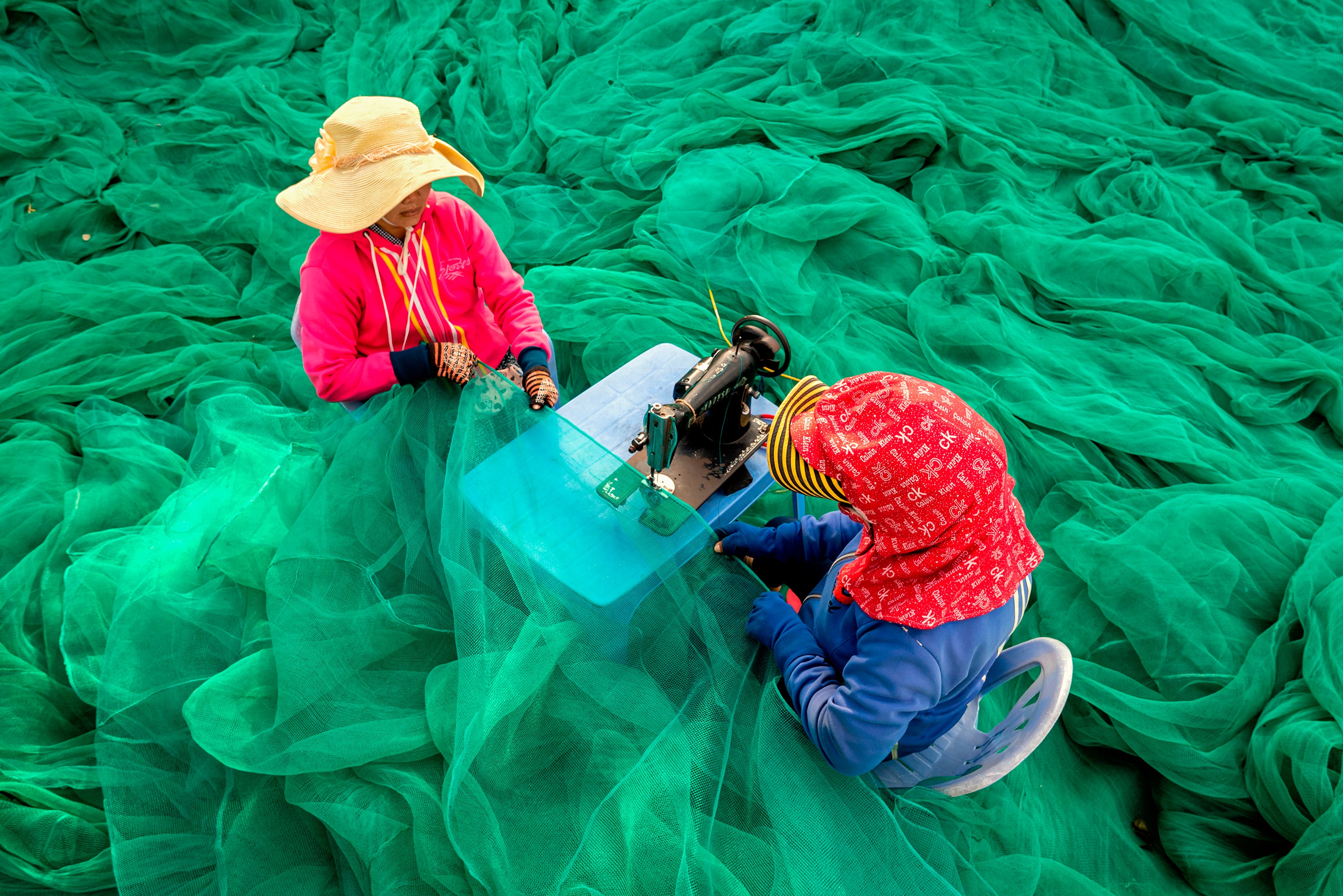 Sewing the fishing nets